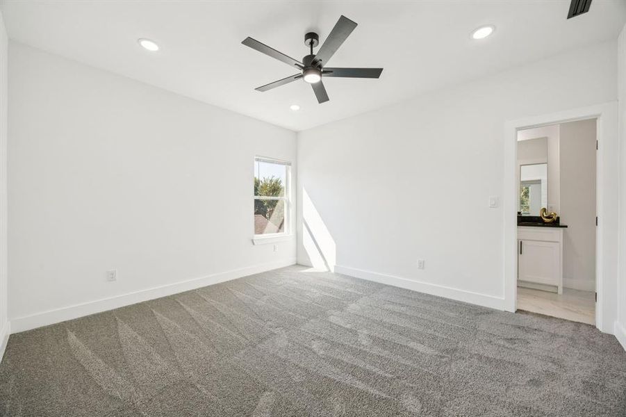 Unfurnished bedroom featuring carpet flooring, ceiling fan, and recessed lighting