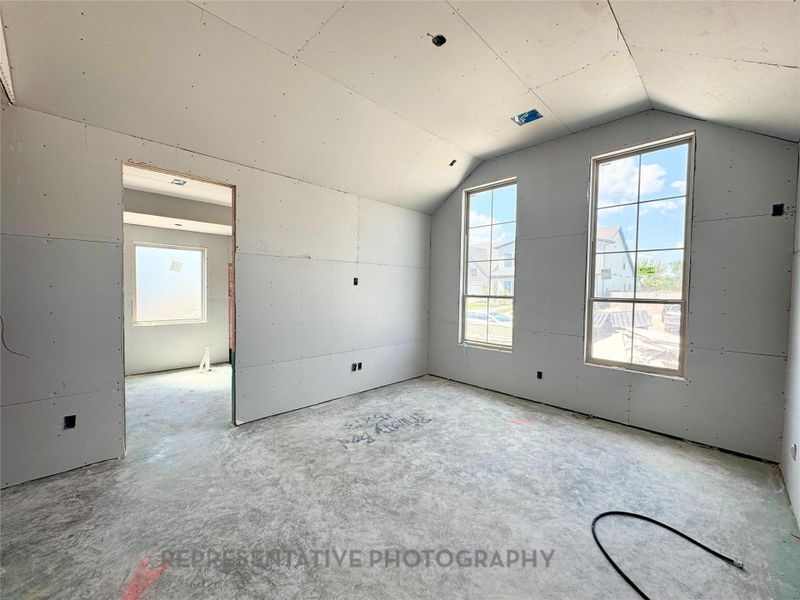 Imagine tall drapes hanging from your primary bedroom windows, further elevating your space!