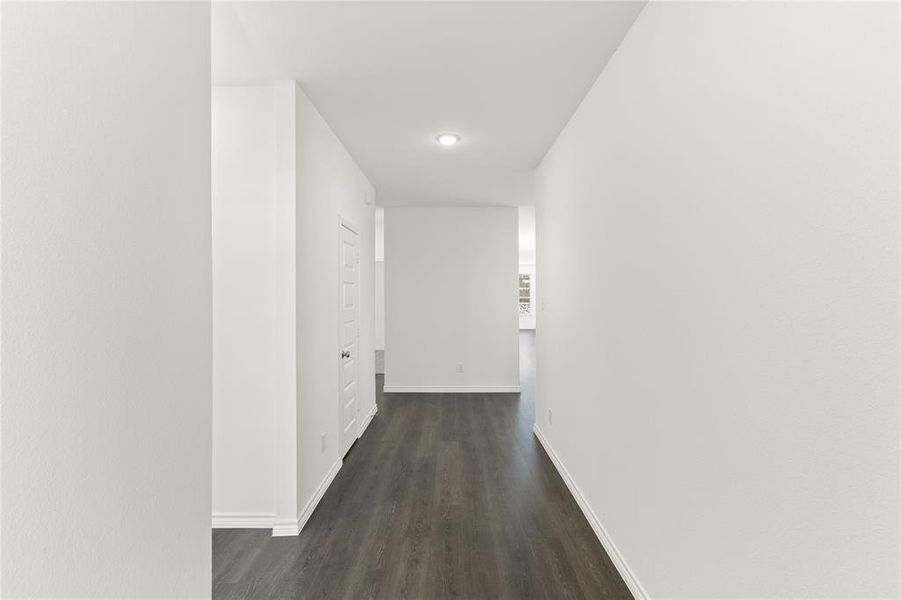 Hallway featuring dark hardwood / wood-style floors