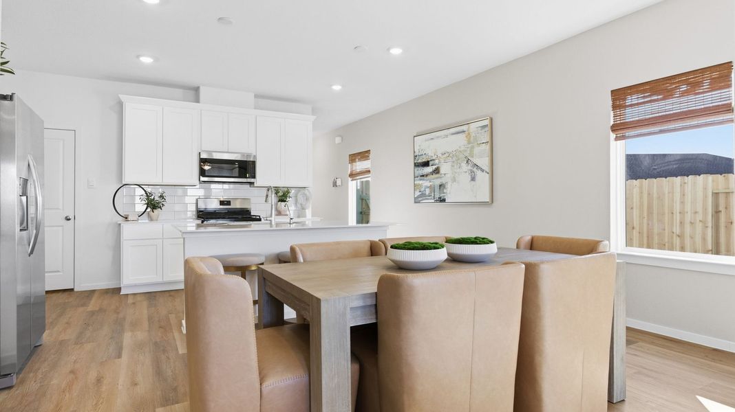Furnished interior view inside a new home in Caldwell Crossing, Iowa Colony (Image 6).