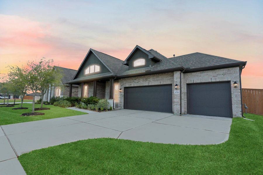 Impressive curb appeal with a striking brick and stone elevation, wide driveway, and spacious 3-car garage. The warm tones and welcoming design set the tone for the beauty inside.  This home has the upgrade front porch elevation and so much more!  Garage door opener included!