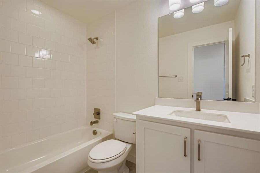 Full bathroom with vanity and shower / tub combination Full bathroom with vanity and shower / tub combination