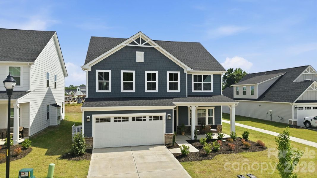 Front exterior of a new home in , Indian Trail, NC, highlighting curb appeal (Image 2). Front exterior of a new home in , Indian Trail, NC, highlighting curb appeal (Image 2).