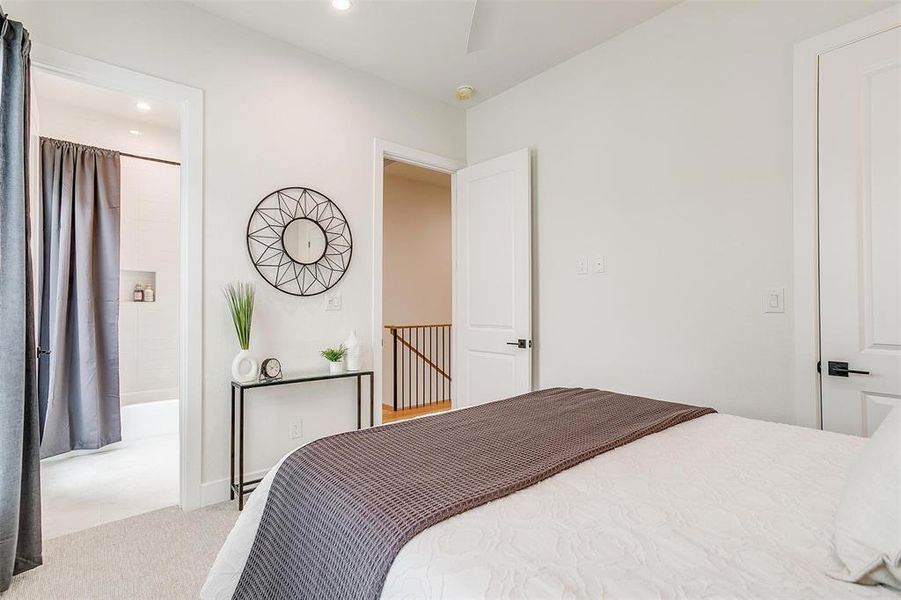 The large second bedroom is spacious and flooded with natural light.