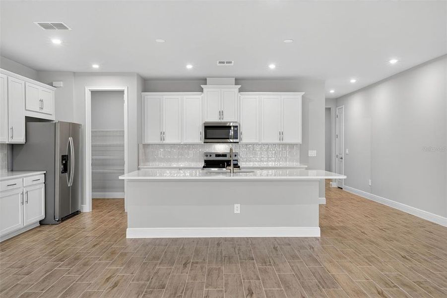 Furnished interior view inside a new home in Windwater, Parrish (Image 4).