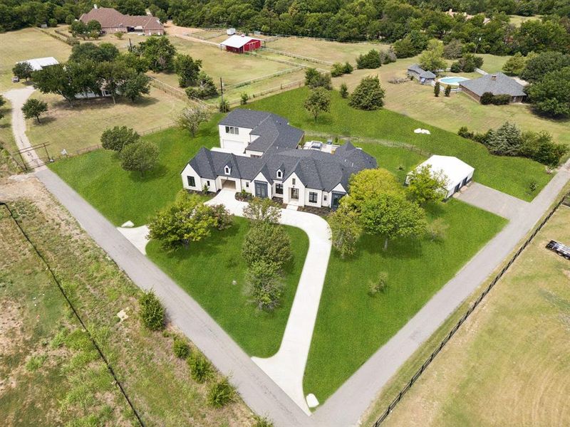 Stunning new construction in sought-after Lovejoy ISD where a private drive leads to peaceful isolation, yet minutes to city conveniences. Horses allowed. No HOA!