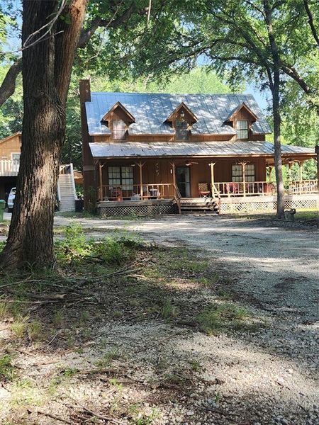 Beautifully set among large shade trees. Notice the full front porch/ Beautifully set among large shade trees. Notice the full front porch/