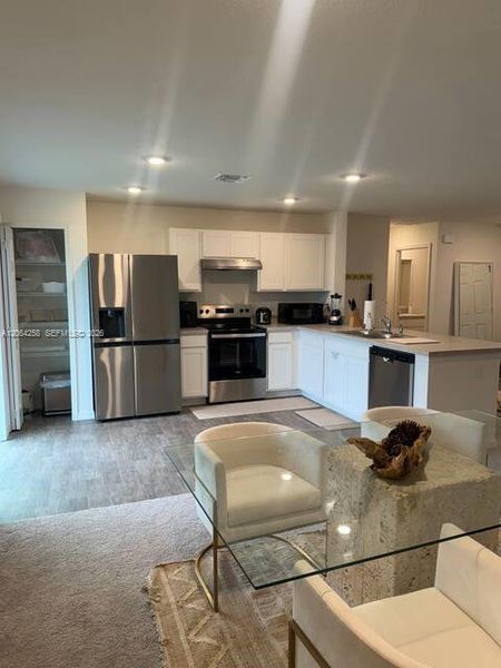 Furnished interior view inside a new home in , Port St. Lucie (Image 11).