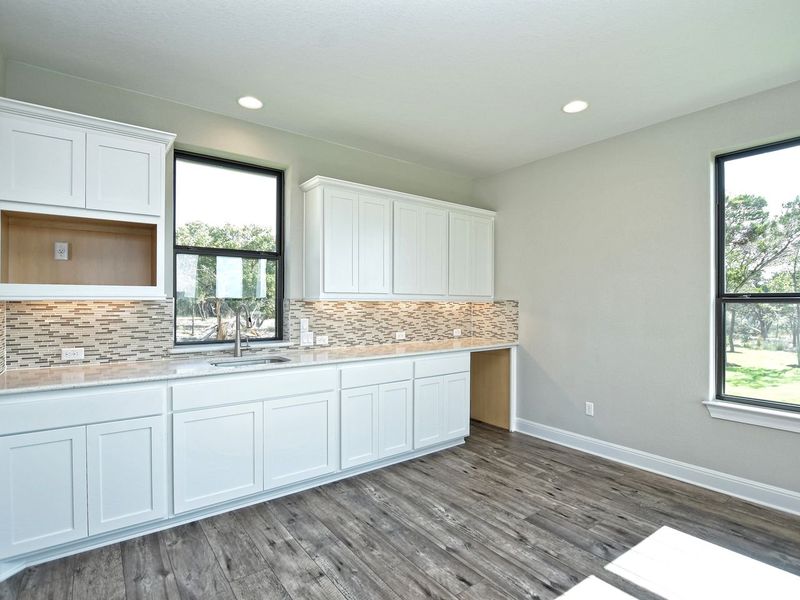 Representative furnished interior of a home built from the Casita by Giddens Homes in Whispering Wind, Bertram (Image 7).