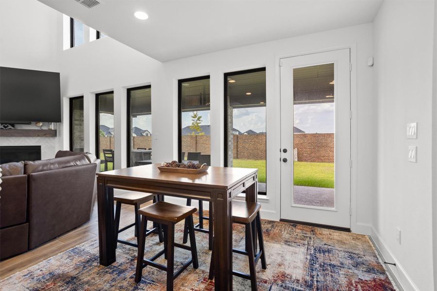 Casual dining area overlooking the backyard