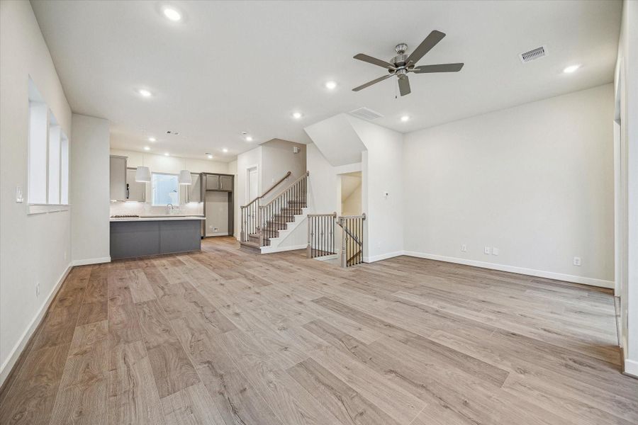 Large great room open to the kitchen that is ideal for entertaining.