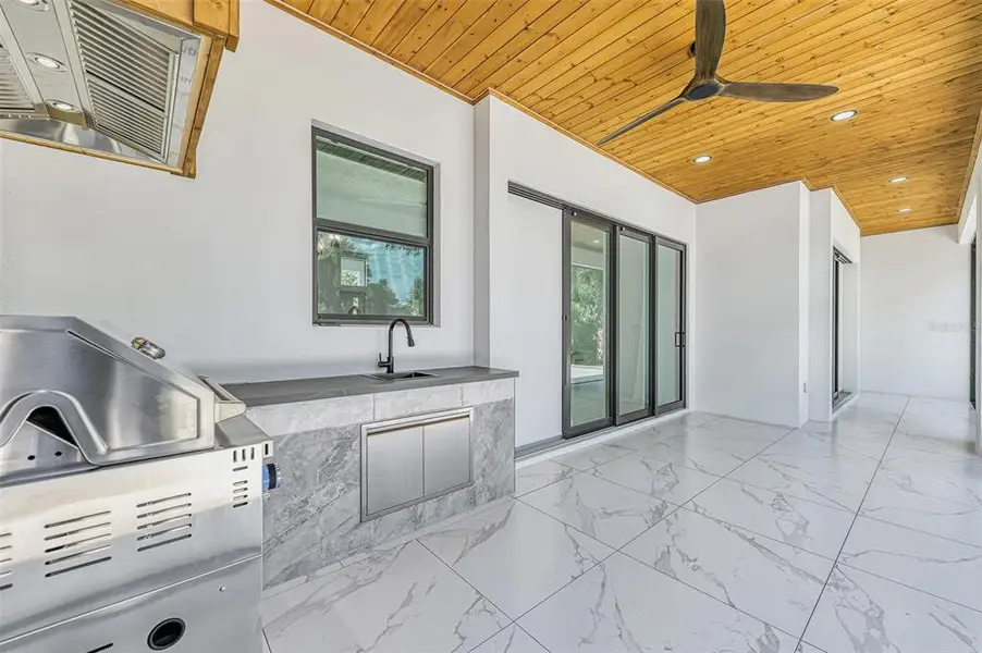Exterior details and patio area of a home in , North Port (Image 38).