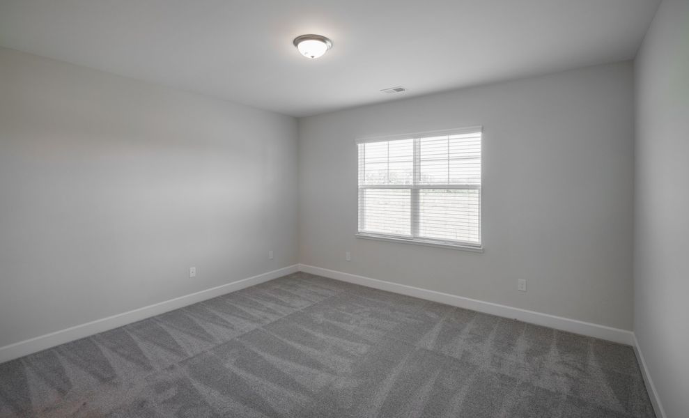 Representative unfurnished interior of a home built from the The Harper by Cothran Homes in Holly Ridge, Greenville (Image 22).