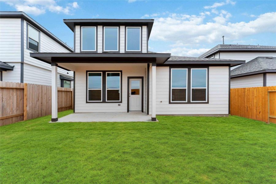 Exterior details and patio area of a home in Bluestem, Brookshire (Image 3).