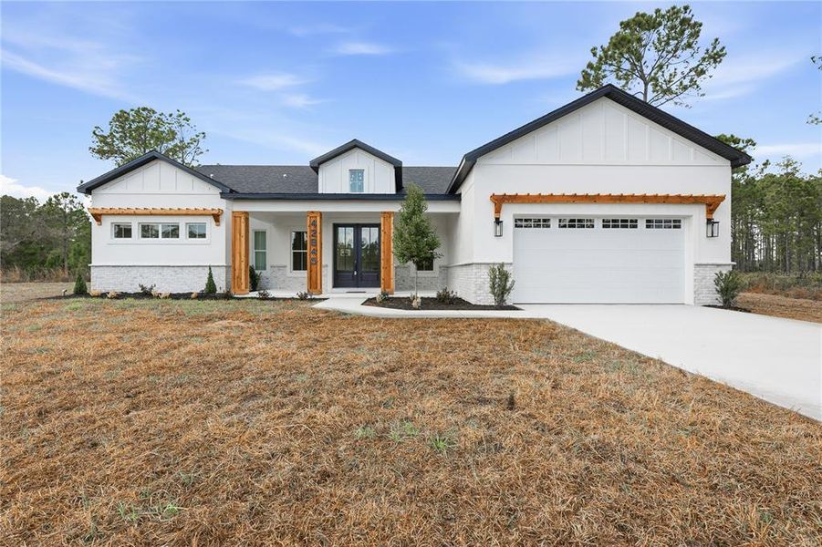 Front exterior of a new home in , Eustis, FL, highlighting curb appeal (Image 1). Front exterior of a new home in , Eustis, FL, highlighting curb appeal (Image 1).