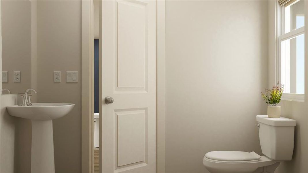 Half bath featuring healthy amount of natural light Half bath featuring healthy amount of natural light