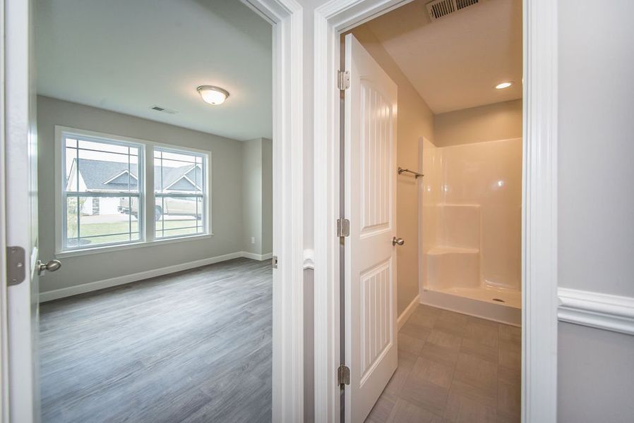 Representative unfurnished interior of a home built from the Beaumont by Enchanted Homes in Guadalupe Heights, Seguin (Image 29).