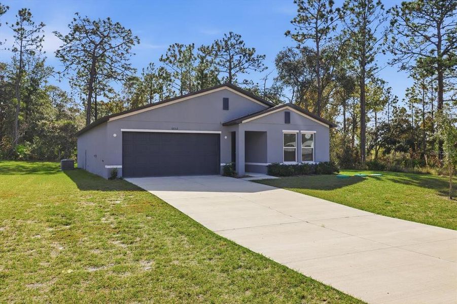 Front exterior of a new home in , Dunnellon, FL, highlighting curb appeal (Image 16).