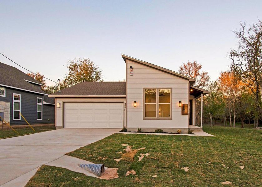 Front exterior of a new home in , Bastrop, TX, highlighting curb appeal (Image 23).