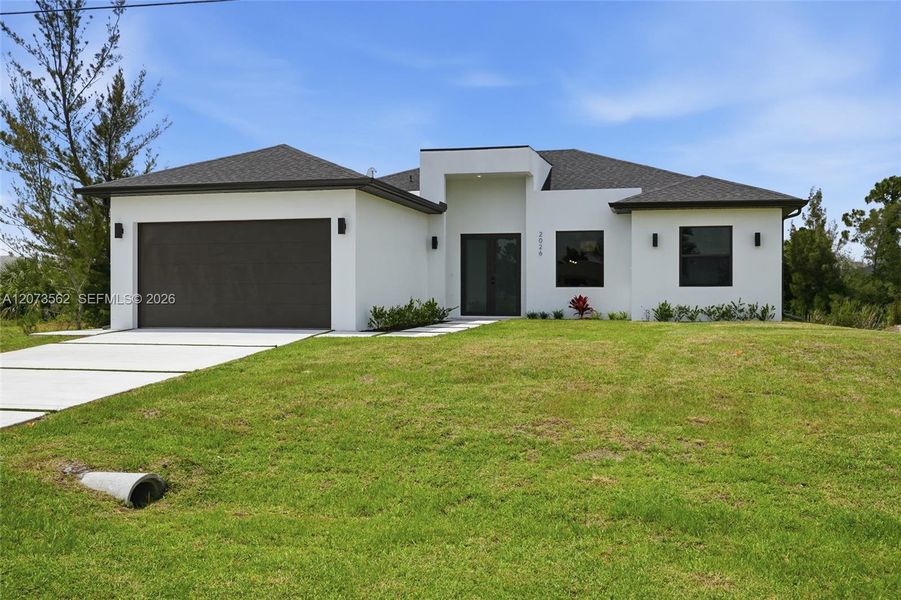 Front exterior of a new home in , Cape Coral, FL, highlighting curb appeal (Image 1). Front exterior of a new home in , Cape Coral, FL, highlighting curb appeal (Image 1).