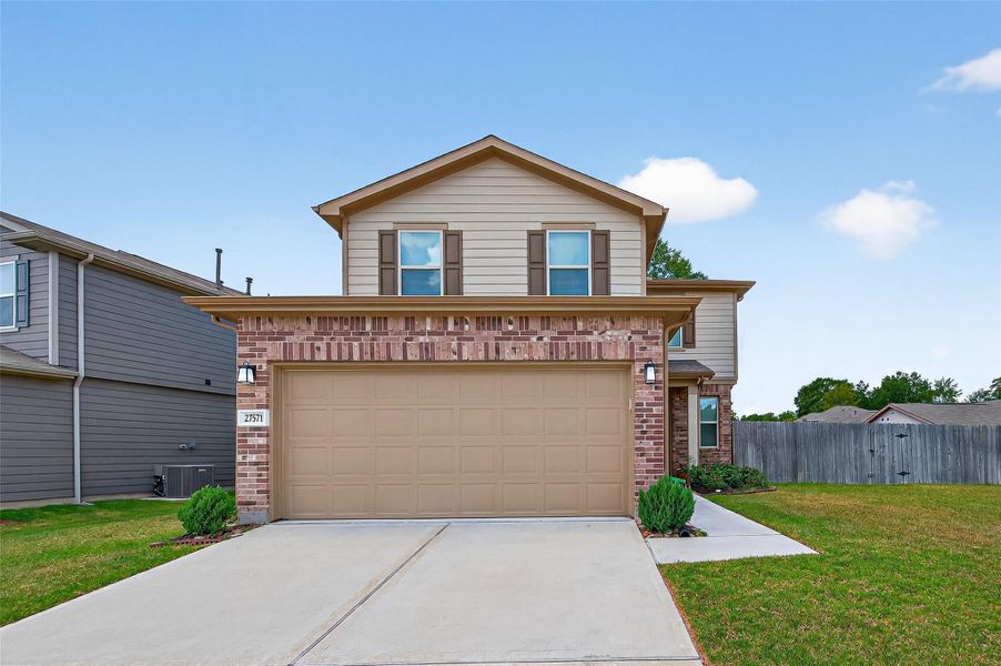 Front exterior of a new home in Creekside Court, Magnolia, TX, highlighting curb appeal (Image 2). Front exterior of a new home in Creekside Court, Magnolia, TX, highlighting curb appeal (Image 2).