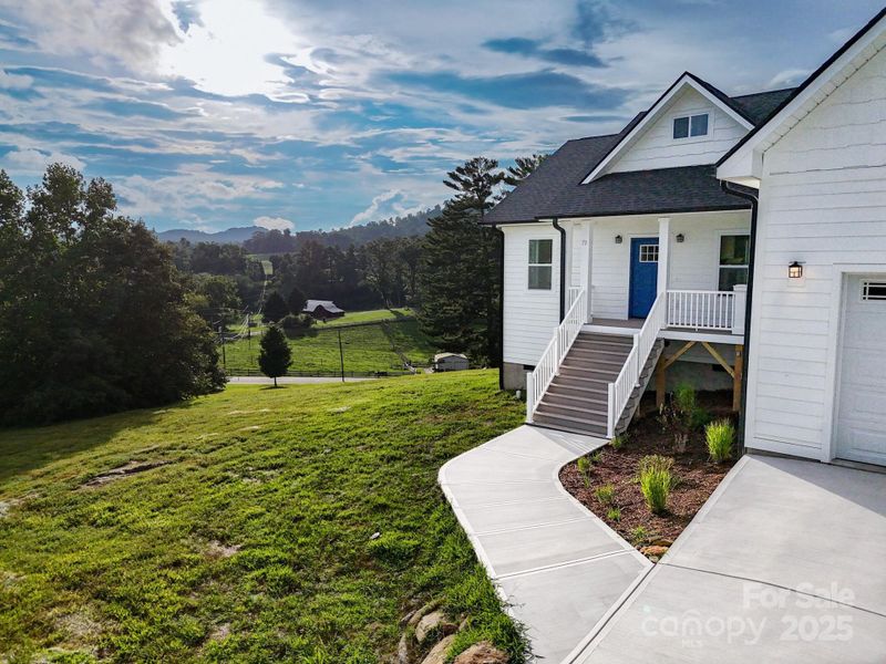 Front exterior of a new home in , Hendersonville, NC, highlighting curb appeal (Image 30). Front exterior of a new home in , Hendersonville, NC, highlighting curb appeal (Image 30).