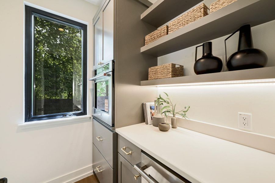 Butler's pantry with second oven, wine fridge.