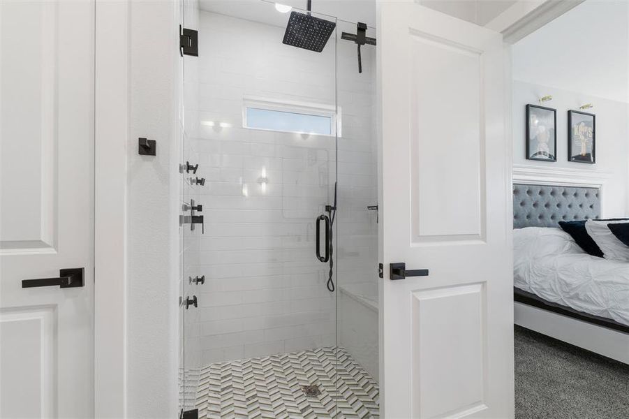 Bathroom with ensuite bathroom and a stall shower