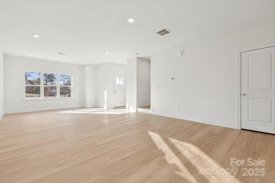 Open-concept living & dining space flows seamlessly to the kitchen & outdoor covered patio Open-concept living & dining space flows seamlessly to the kitchen & outdoor covered patio