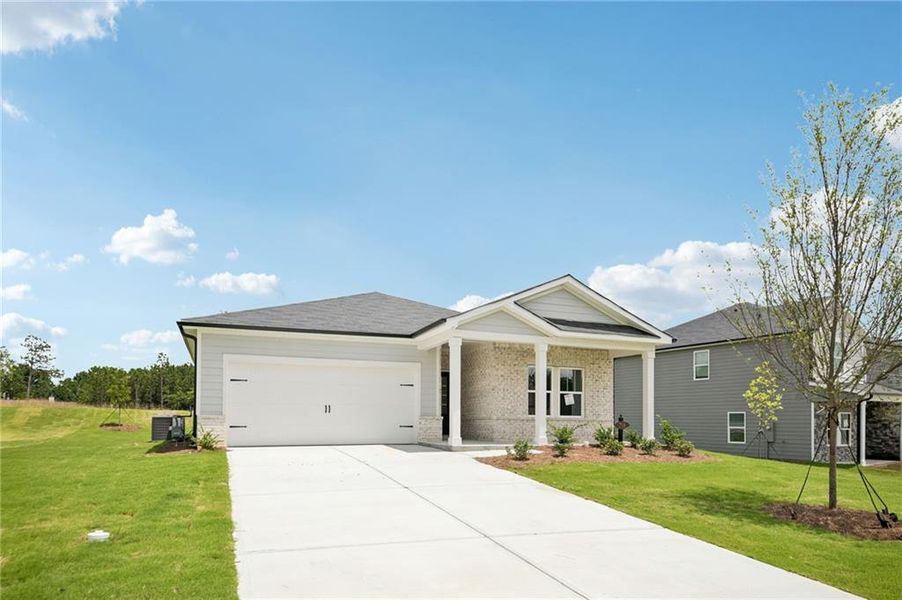 Front exterior of a new home in Northwoods at Mirror Lake, Villa Rica, GA, highlighting curb appeal (Image 26).