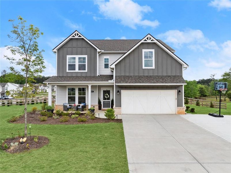 Front exterior of a new home in , Dacula, GA, highlighting curb appeal (Image 25).