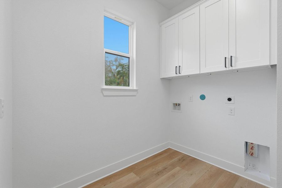 Laundry room with extra storage.