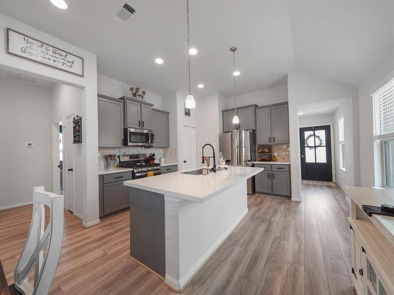 Look at the gorgeous VCT high grade laminate tiles which are waterproof and made to last! The kitchen faucet has been upgraded as well as new pulls on the cabinetry and contractor installed miniblinds throughout the home.