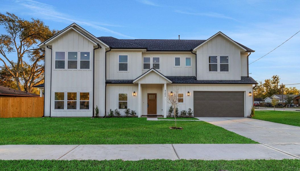 Sophisticated two-story residence on a prominent corner lot, showcasing bold architectural lines, curated landscaping, a wide driveway, and an attached two-car garage. Sophisticated two-story residence on a prominent corner lot, showcasing bold architectural lines, curated landscaping, a wide driveway, and an attached two-car garage.