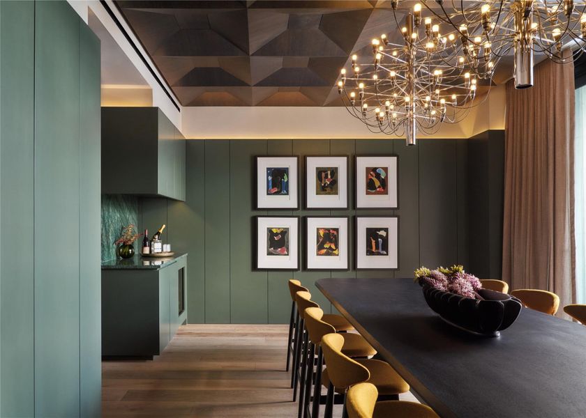 Dramatic coffered ceilings and rich hardwood flooring define this architectural dining room. Dramatic coffered ceilings and rich hardwood flooring define this architectural dining room.