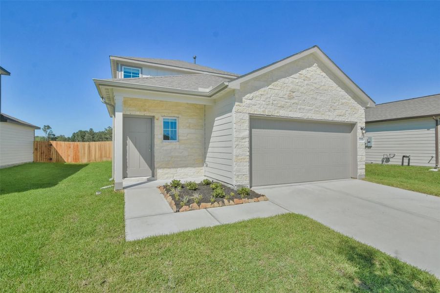 Front exterior of a new home in The Villages at WestPointe, Dayton, TX, highlighting curb appeal (Image 49).