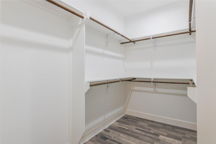 walk-in closet in primary bedroom walk-in closet in primary bedroom