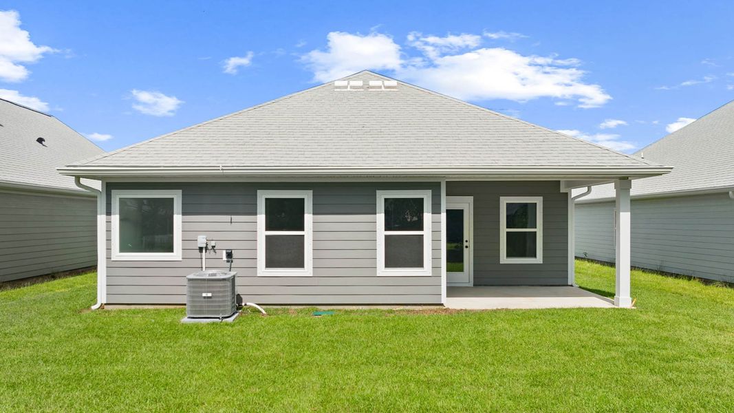 Exterior details and patio area of a home in Caballeros Estates At Hombre, Panama City Beach (Image 4).