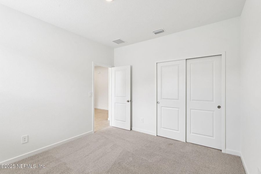 Spacious, unfurnished interior of a new home in Lakes at Bella Lago - Signature Series, Green Cove Springs (Image 29).