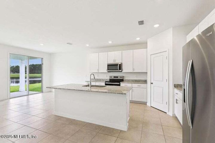 Furnished interior view inside a new home in Lakes at Bella Lago - Signature Series, Green Cove Springs (Image 12). Furnished interior view inside a new home in Lakes at Bella Lago - Signature Series, Green Cove Springs (Image 12).