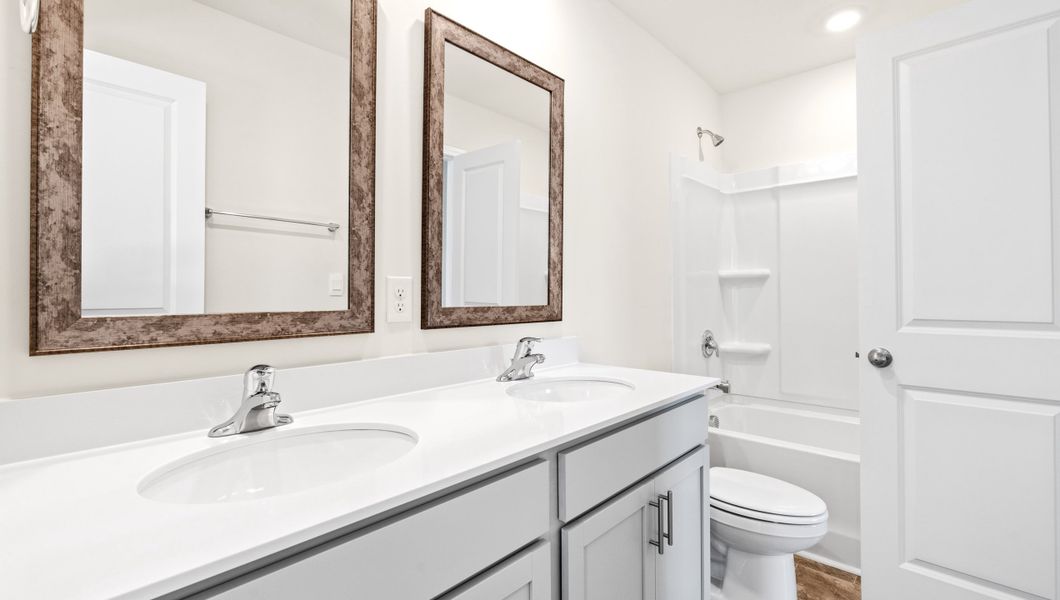 Representative furnished interior of a home built from the WILMINGTON by D.R. Horton in Benjamin's Grove, Woodruff (Image 12).