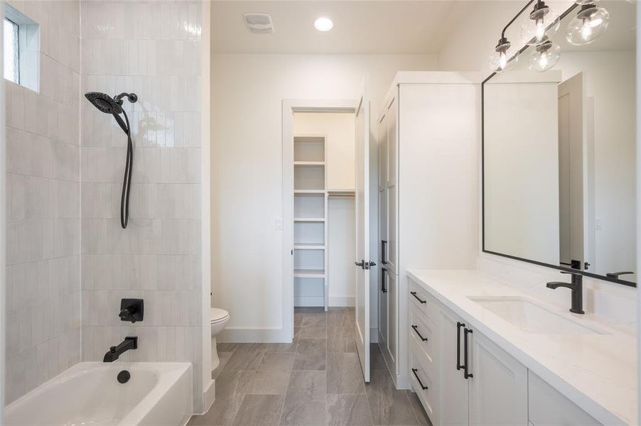 Well-appointed en suite bathrooms throughout the home featurecontemporary fixtures and hardware, and a collection of fine porcelain and marble tile.