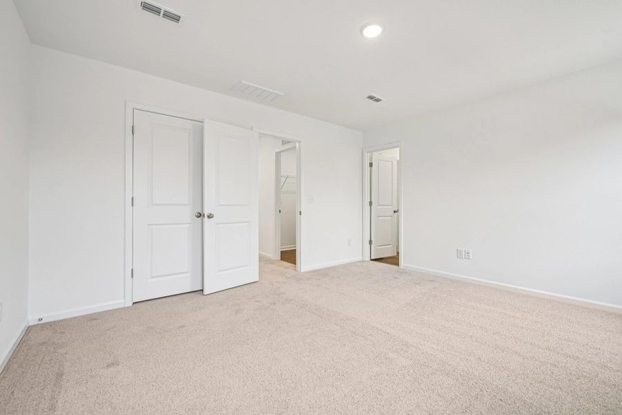 Primary Bed - A sophisticated retreat with style.