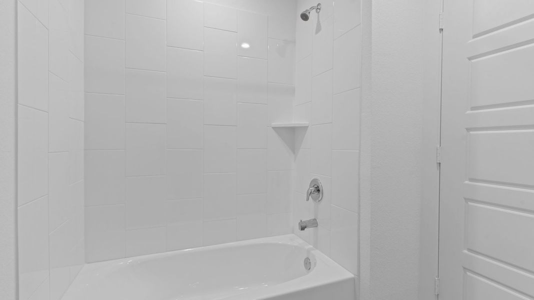 Representative furnished interior of a home built from the Caden by D.R. Horton in Caldwell Crossing, Iowa Colony (Image 12).