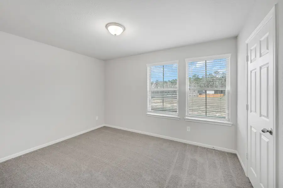 Representative unfurnished interior of a home built from the Floor Plan 1597 by Colina Homes in Rollingbrook Estates, Baytown (Image 27).