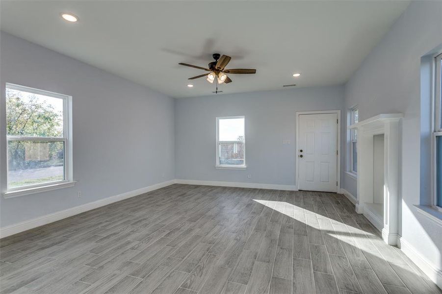 Spare room featuring ceiling fan and light hardwood / wood-style flooring