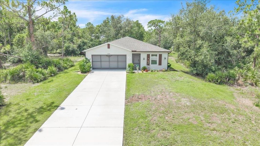 Front exterior of a new home in , Punta Gorda, FL, highlighting curb appeal (Image 2). Front exterior of a new home in , Punta Gorda, FL, highlighting curb appeal (Image 2).