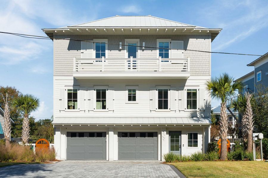 Front exterior of a new home in , Isle Of Palms, SC, highlighting curb appeal (Image 1).