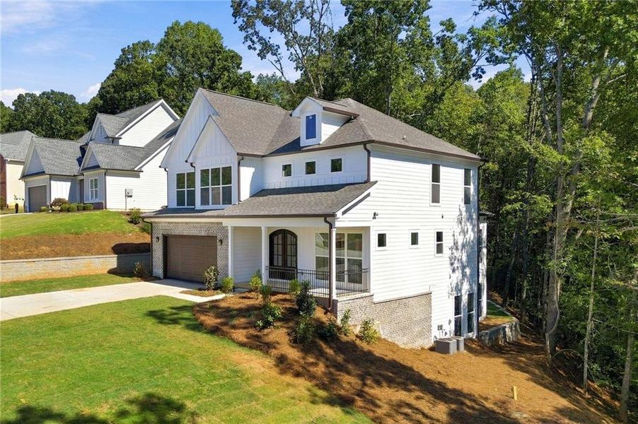 Front exterior of a new home in , Flowery Branch, GA, highlighting curb appeal (Image 26).