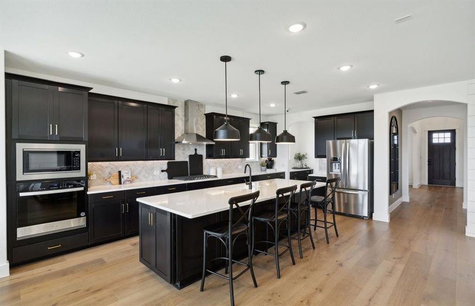 Gourmet kitchen designed for culinary excellence and entertaining *Model representation Gourmet kitchen designed for culinary excellence and entertaining *Model representation